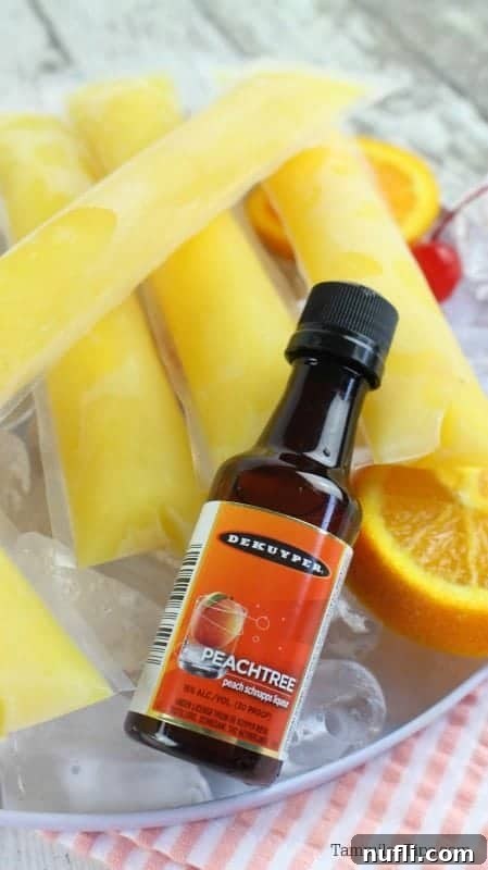 Fuzzy Navel Cocktail Freezer Pops 3 peachtree bottle with fuzzy navel ice pops in a bowl of ice