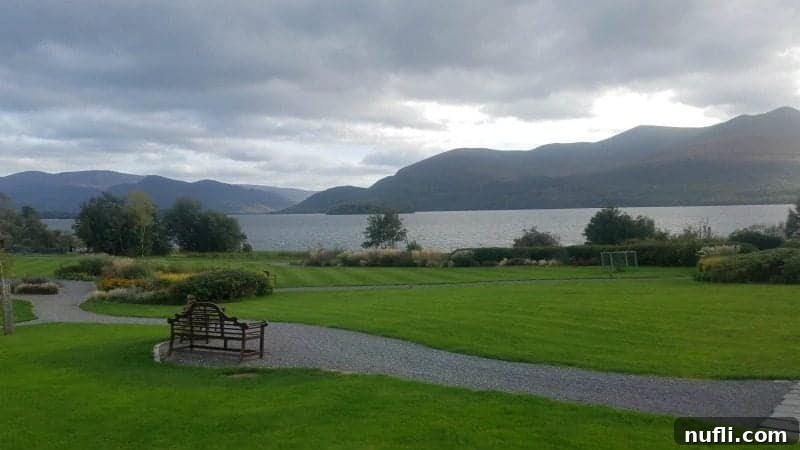 Lakeside Elegance in Killarney: The Europe Hotel 13 Beautifully landscaped lawns with inviting benches, offering idyllic spots to gaze upon the picturesque lake at The Europe Hotel Killarney.