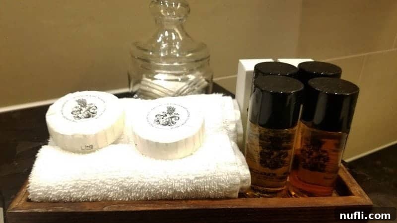 Lakeside Elegance in Killarney: The Europe Hotel 4 Elegant tray featuring luxury soap, shampoo, and essential toiletries in The Europe Hotel Killarney bathroom.