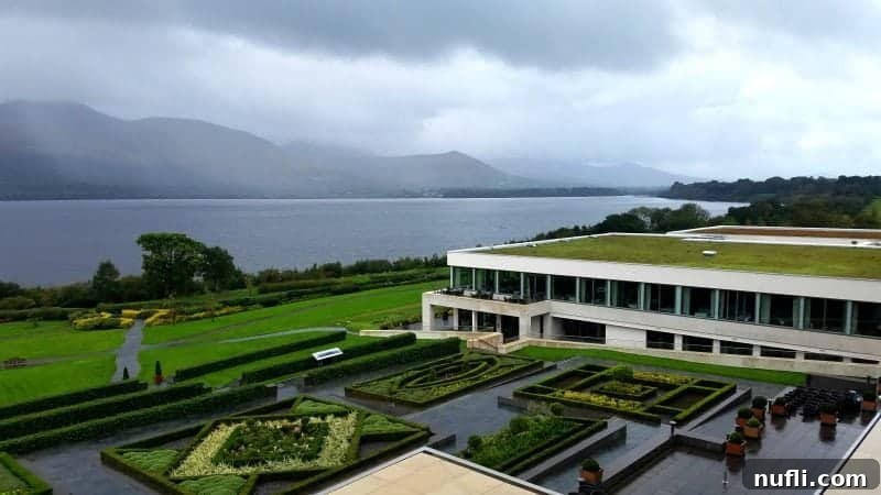 Lakeside Elegance in Killarney: The Europe Hotel 6 Panoramic view from The Europe Hotel Killarney overlooking the serene lake and lush hotel gardens.