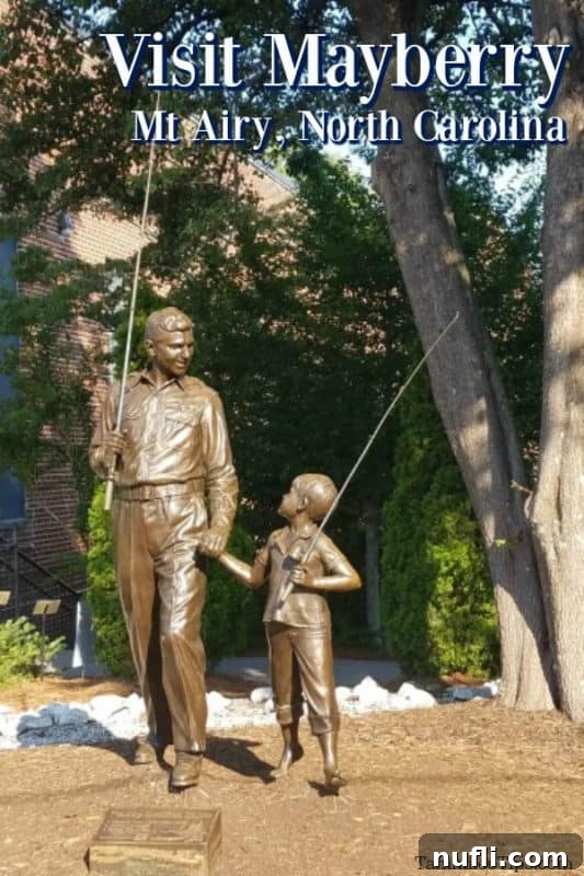 Andy Griffith statue welcoming visitors to Mayberry in Mount Airy, North Carolina