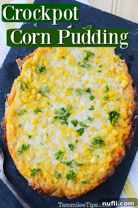 Crockpot Corn Pudding text written at the top of the photo with corn pudding on a slate background with a spoon