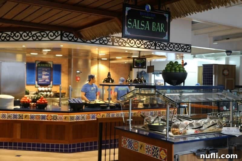 The vibrant salsa bar at Blue Iguana Cantina on the Carnival Imagination, showcasing an array of fresh toppings and sauces.
