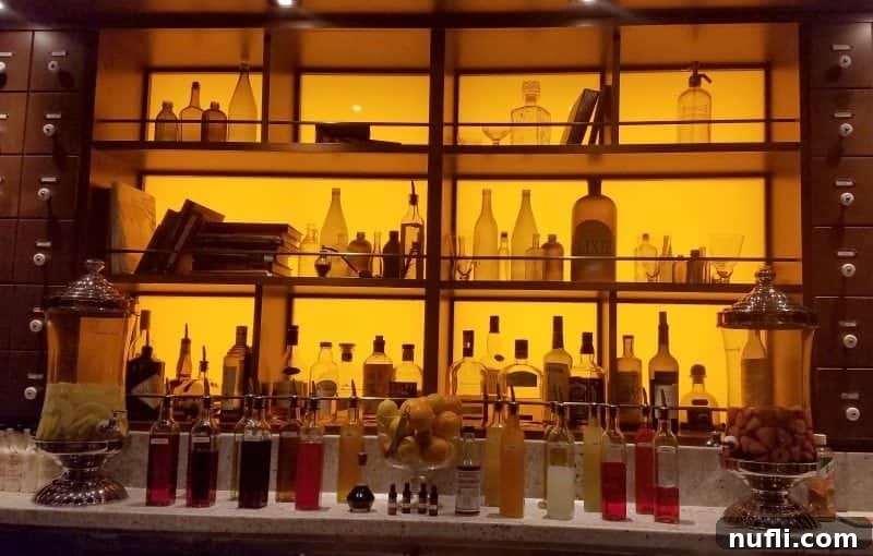 The sophisticated interior of the Alchemy Bar, featuring a well-stocked bar and elegant lighting, inviting guests for a unique cocktail experience.