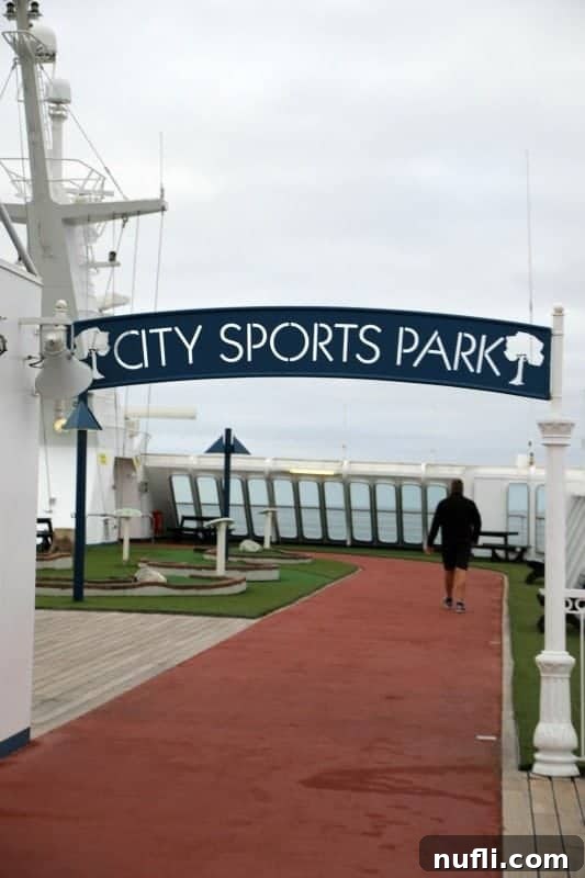 The outdoor running track of the City Sports Park on the Carnival Imagination, with blue flooring and clear markings.