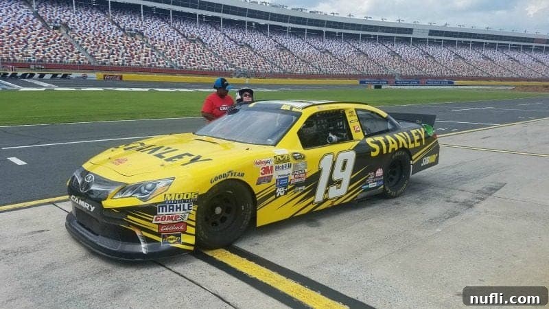 Tammilee getting into a Nascar at Charlotte Motor Speedway nascar track