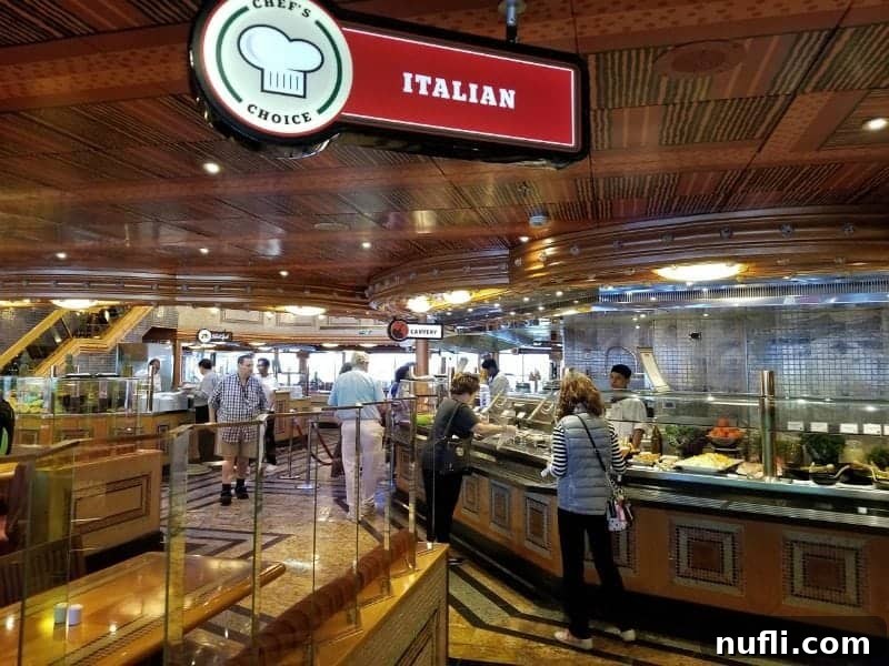 The Chef's Choice Italian station on the buffet, where guests with plates eagerly await freshly prepared dishes.