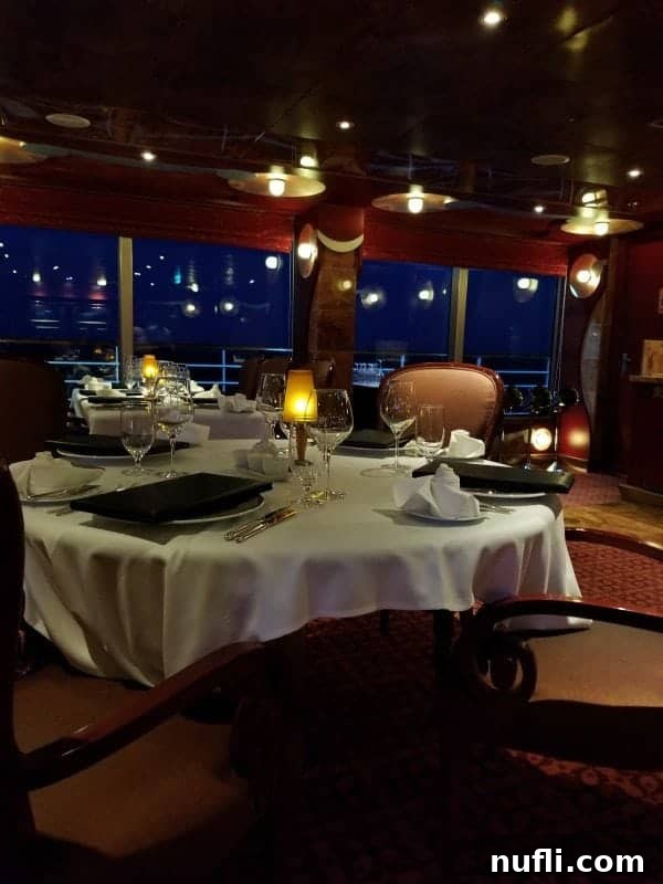 Elegant steakhouse seating on the Carnival Splendor, with tables impeccably set for a sophisticated dinner experience.