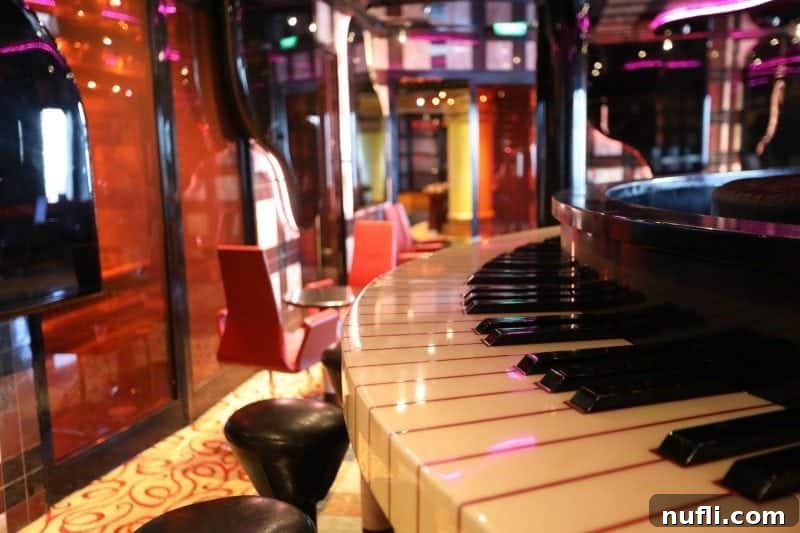 Vibrant bar area with piano keys design and comfortable stools, ready for a night of entertainment.