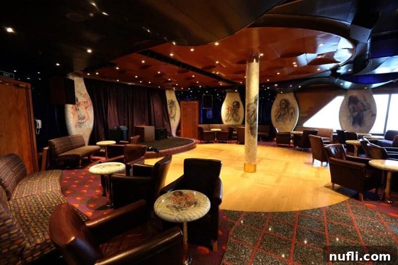 Elegant bar with artistic paintings adorning the room, complemented by comfortable tables and chairs.