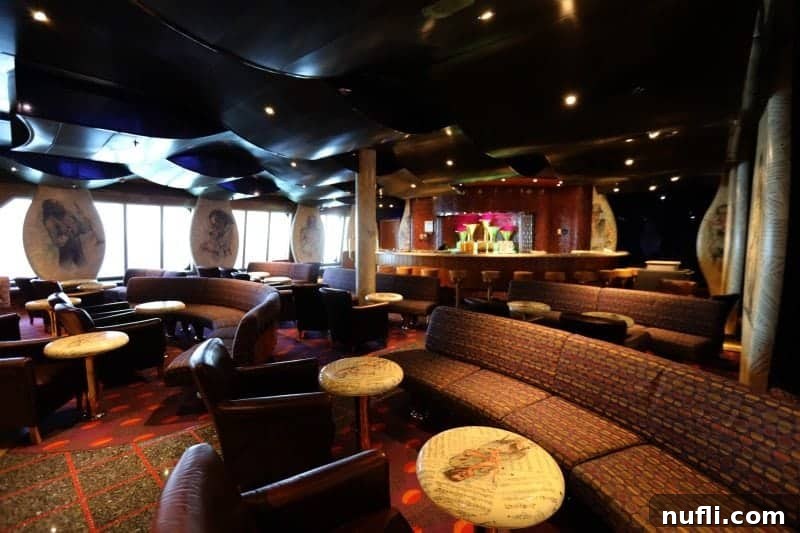 Cozy bar area featuring a long bench and small tables, decorated with paintings of musicians, creating a relaxed vibe.