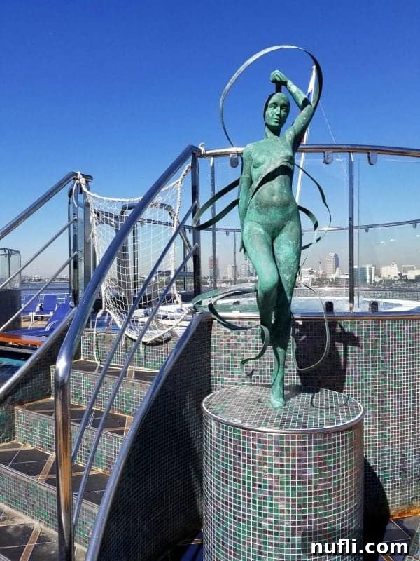 Charming statue next to stairs leading up to a hot tub, inviting guests to unwind.