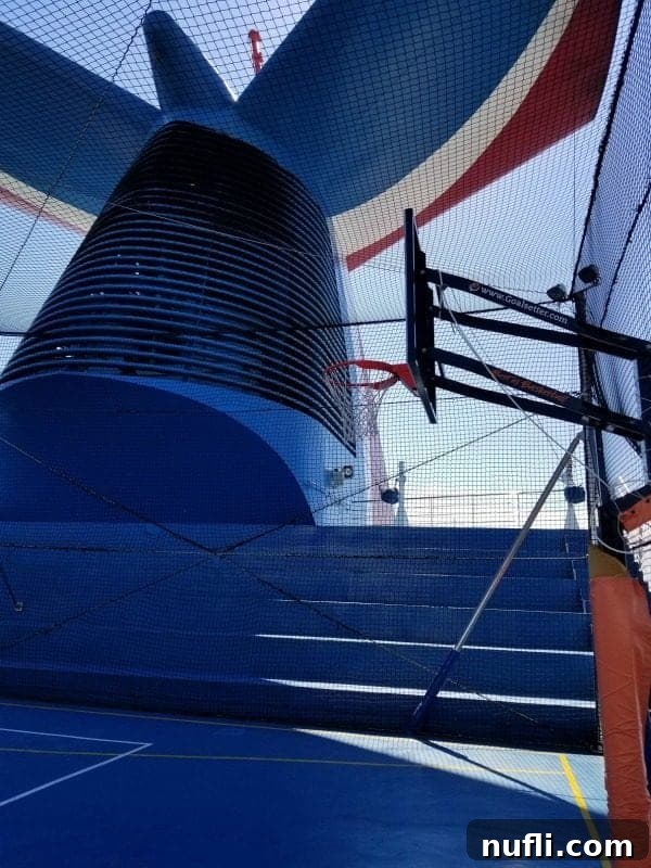 Basketball court in front of the iconic Carnival Funnel, offering active recreation with a view.