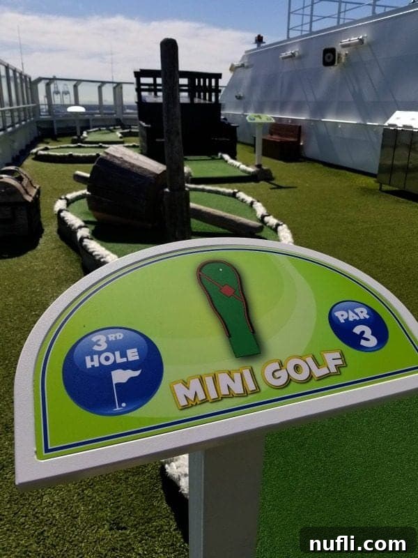 A sign marking the 3rd hole of the mini golf course, inviting players to continue their game on the Carnival Splendor.