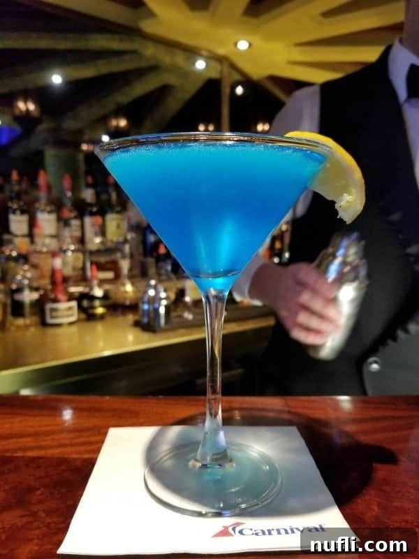 sea blue martini in a glass on a carnival napkin 