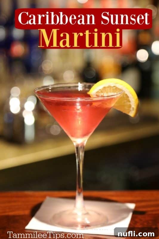 Golden Hour Island Martini 2 Caribbean Martini over a red drink in a martini glass with a lemon wheel garnish