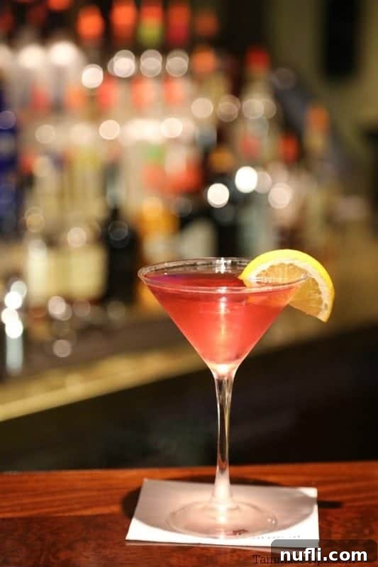 Golden Hour Island Martini 6 Caribbean Sunset martini in a martini glass on a white napkin