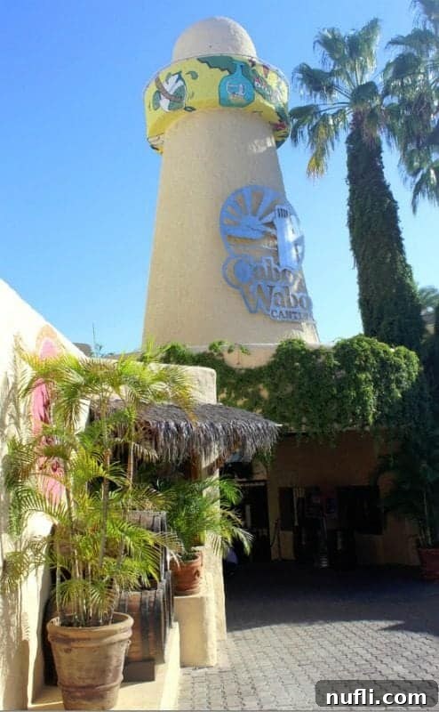 Cabo Wabo Cantina entrance and lighthouse, a popular spot in Cabo San Lucas for cruise ship passengers seeking entertainment.