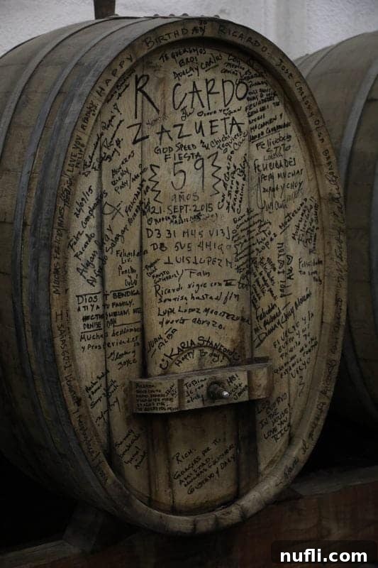 wine barrel with writing all over it 