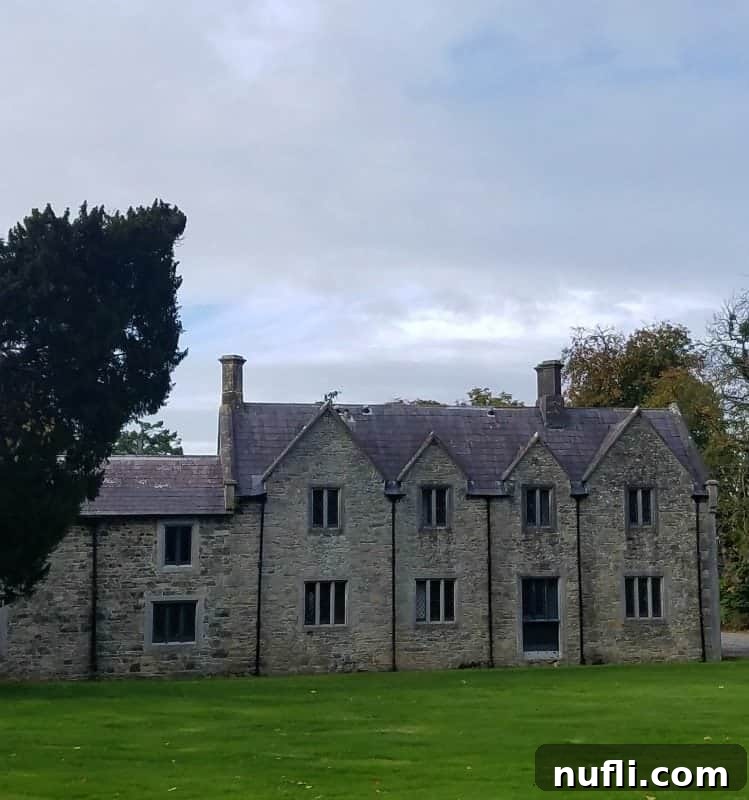 stone building with trees around it 