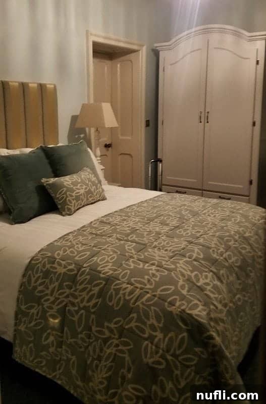 room with a bed near an armoire 