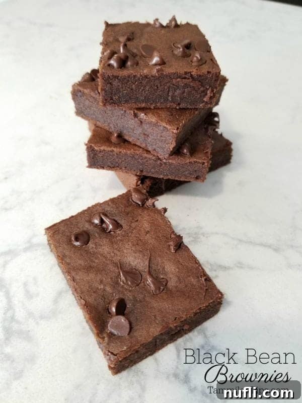 Irresistibly Fudgy Black Bean Brownies 4 Black Bean Brownies under squares of brownies