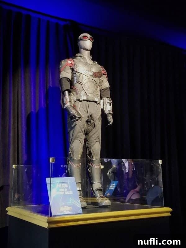 The intricately designed Falcon costume worn by Anthony Mackie, displayed prominently at the Marvel premiere.