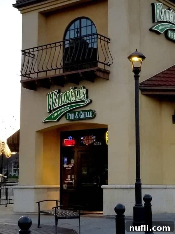 Exterior of Waddell's Neighborhood Pub and Grill with entrance door