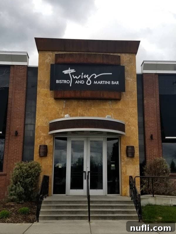 Twigs Bistro and Martini Bar sign over stairs leading up to glass doors