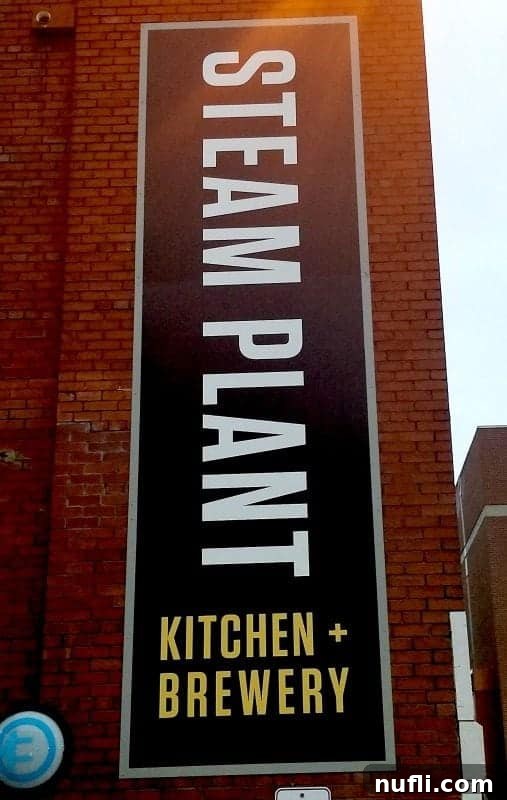 Steam Plant Kitchen and Brewery sign on a brick wall