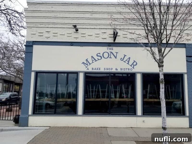 Exterior of the Mason Jar Bake Shop and Bistro with windows and trees outside