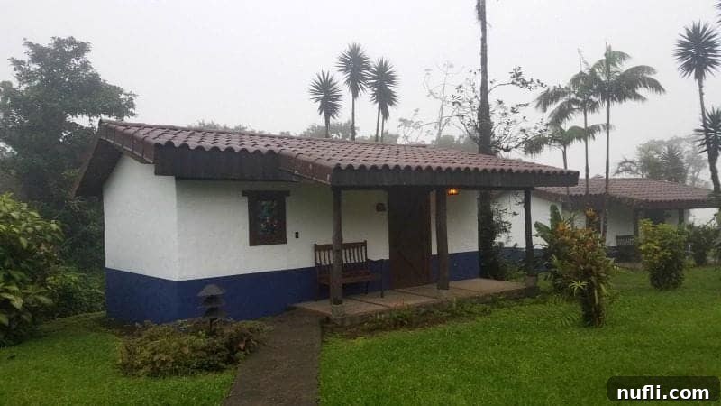 A charming and inviting casita at Villa Blanca Cloud Forest Resort, showcasing its rustic yet elegant architecture amidst lush surroundings.