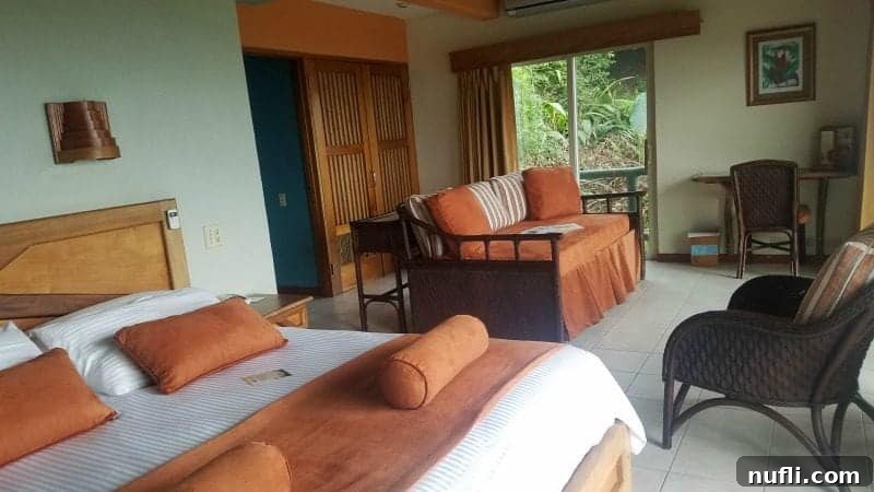 Si Como No Resort Costa Rica Video Tour 4 hotel room with bed, day bed, chairs, and windows to the forest