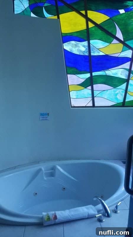 Si Como No Resort Costa Rica Video Tour 5 Bath tub with a stained glass window over it