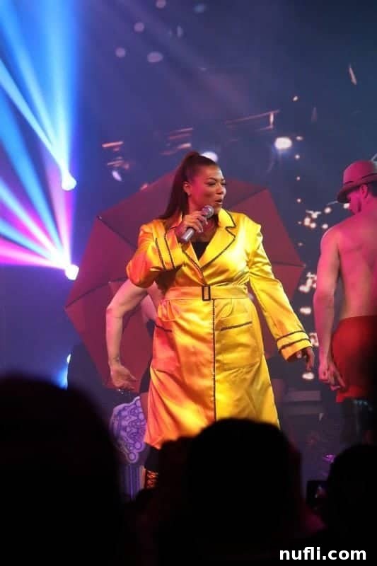 Queen Latifah captivating the audience with her powerful stage presence and vibrant performance during the Lip Sync Battle