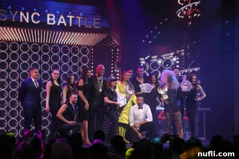 A group of enthusiastic audience members gathered under the Lip Sync Battle stage, thoroughly enjoying the electrifying show