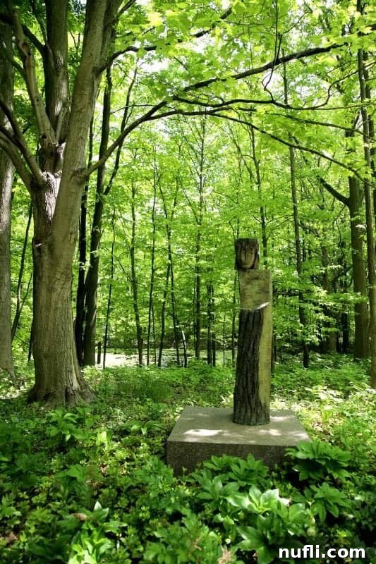 Sculpture nestled in the middle of a lush forest
