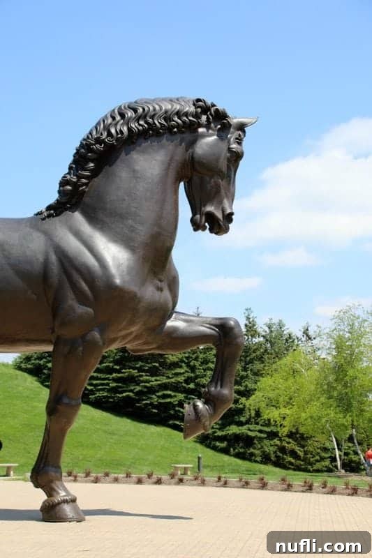 Large horse sculpture in the middle of beautiful gardens