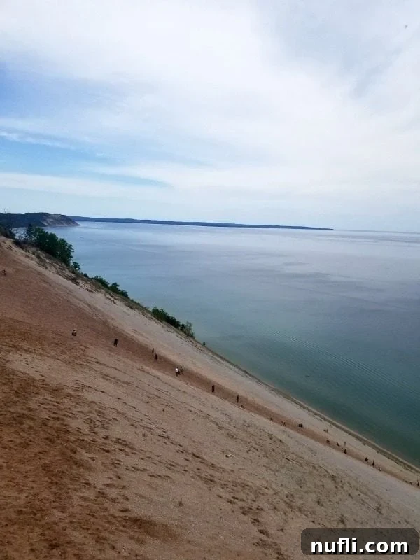 Giant sand hill leading down to the water at Sleeping Bear Dunes
