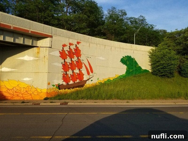 Ship mural on the side of a road building