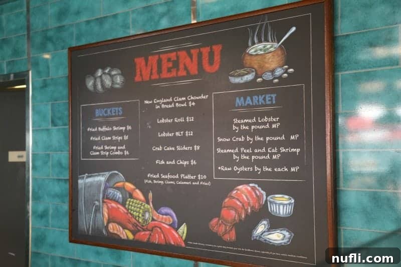The menu board at Seafood Shack, clearly displaying a variety of delicious seafood options and their prices.