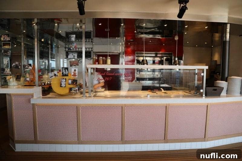 A freshly baked pizza, hot and delicious, at Pizza Del Capitano, ready to be enjoyed by Carnival Horizon guests.