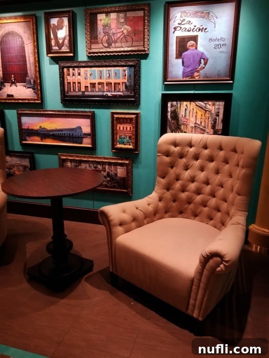 A stylish chair within the Havana Bar, featuring evocative photos of Cuba on the wall, creating an authentic and vibrant atmosphere.
