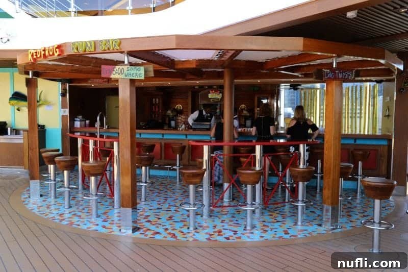 The lively Red Frog Rum Bar, a vibrant poolside spot on the Carnival Horizon, offering tropical drinks and a fun atmosphere.