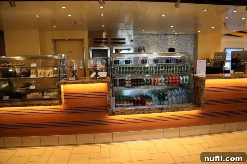 The inviting Coffee Shop on Carnival Horizon, featuring tempting bakery display cases and a warm, welcoming atmosphere.