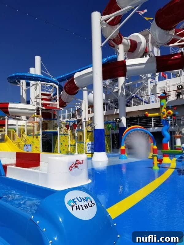 The iconic Cat in The Hat themed waterslide, brightly colored in red and white stripes and ready for riders to enjoy.