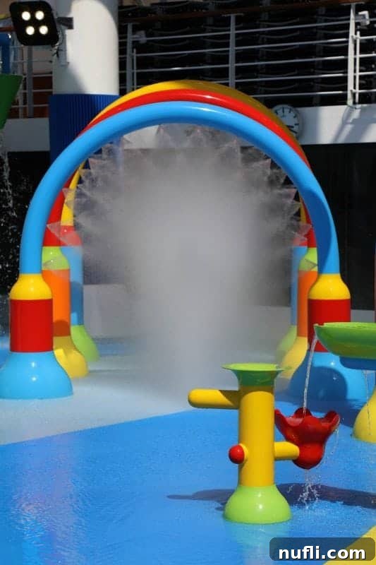 A vibrant water play area with multiple colorful features for children, part of the Dr. Seuss WaterWorks attraction.