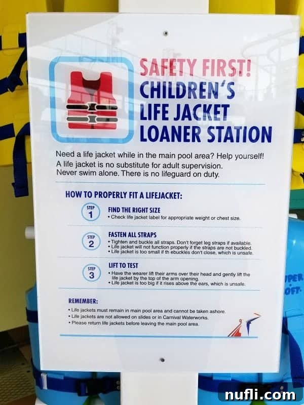 A well-stocked life jacket loaner station on the Lido Deck, offering various sizes for children's safety and convenience.