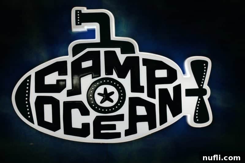 The official Camp Ocean sign, with cheerful underwater-themed graphics and a welcoming design for kids.