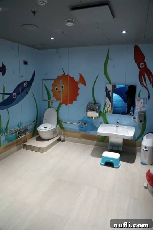 A themed kids' bathroom with an enchanting underwater design, part of the thoughtful facilities within Camp Ocean.
